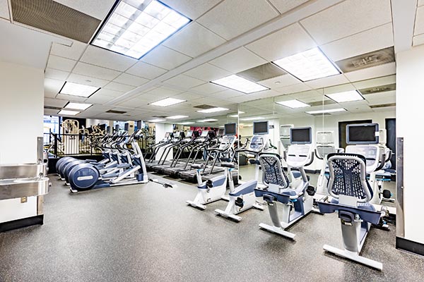 http://Our%20personal%20fitness%20center%20in%20DC%20with%20a%20row%20of%20ellipticals%20and%20cycling%20machines%20in%20front%20of%20a%20wall%20of%20mirrors.