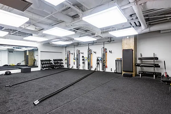 An open gym floor with black turf